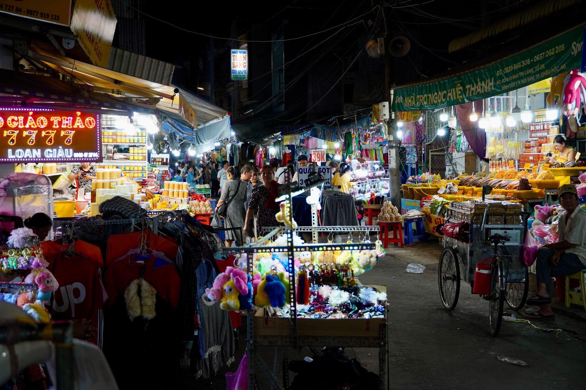 Bustling night market with colorful stalls